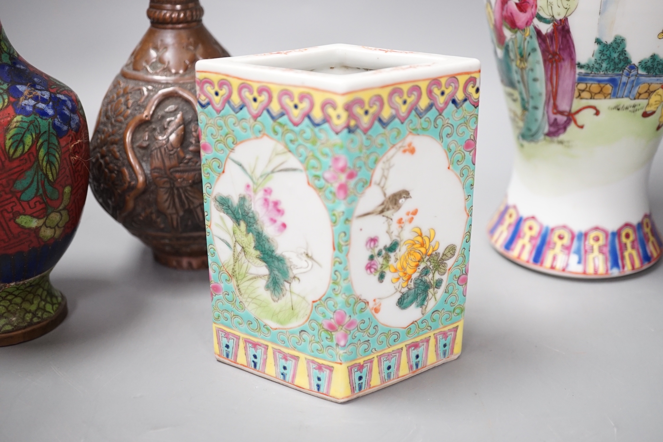 A group of Chinese porcelain vases, a cloisonné enamel vase and pot and a Middle Eastern metal vase, tallest 23 cm